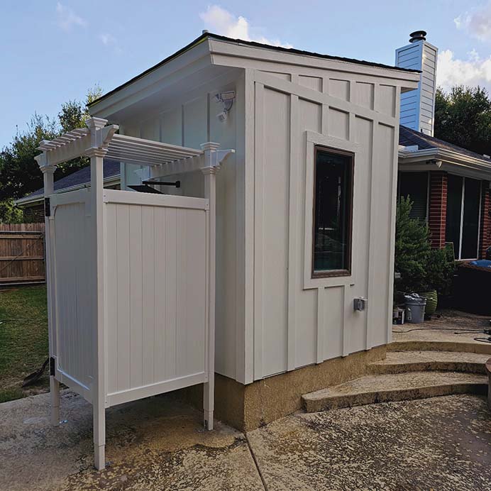Custom-built backyard ADU with outdoor shower and board-and-batten siding – J Field Construction Texas