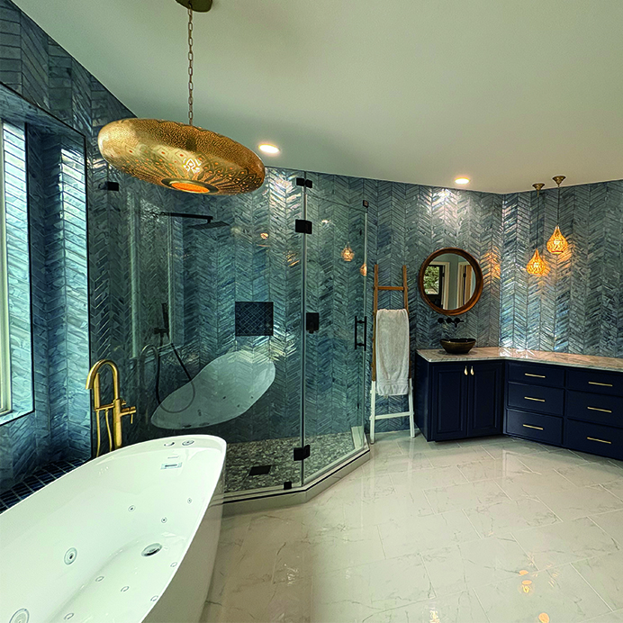 Luxury custom bathroom with glass shower, soaking tub, and navy blue cabinets – J Field Construction Texas